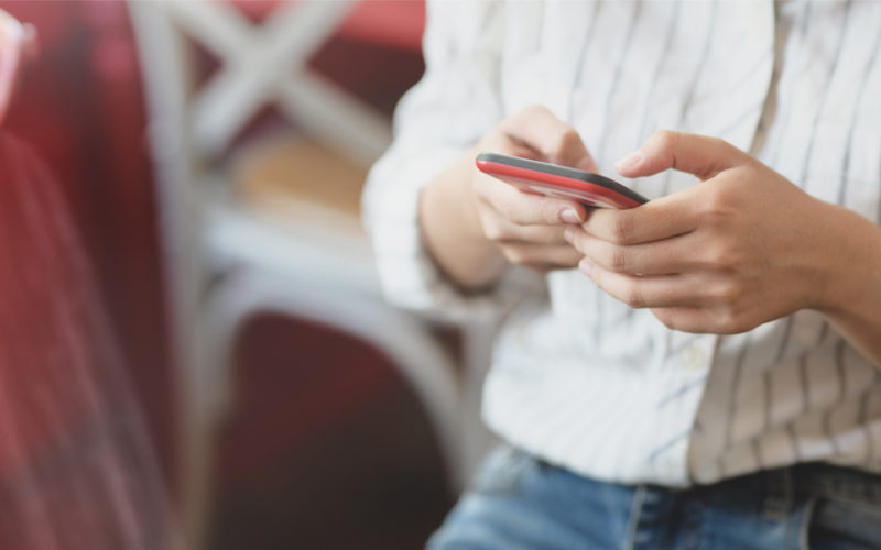 A woman holding a mobile